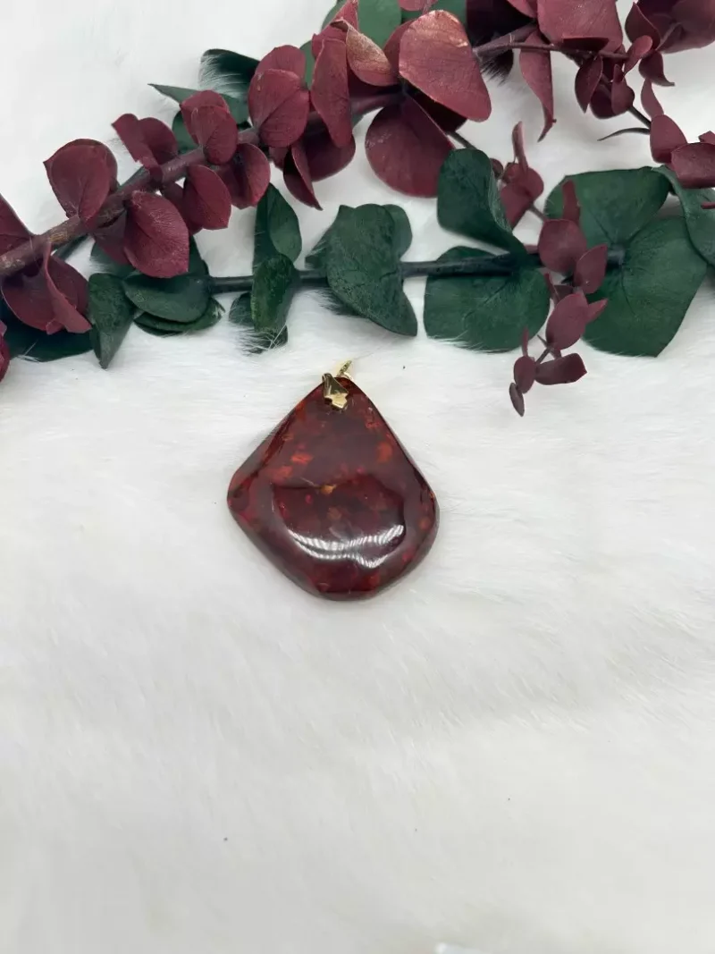 deep reddish brown amber pendant